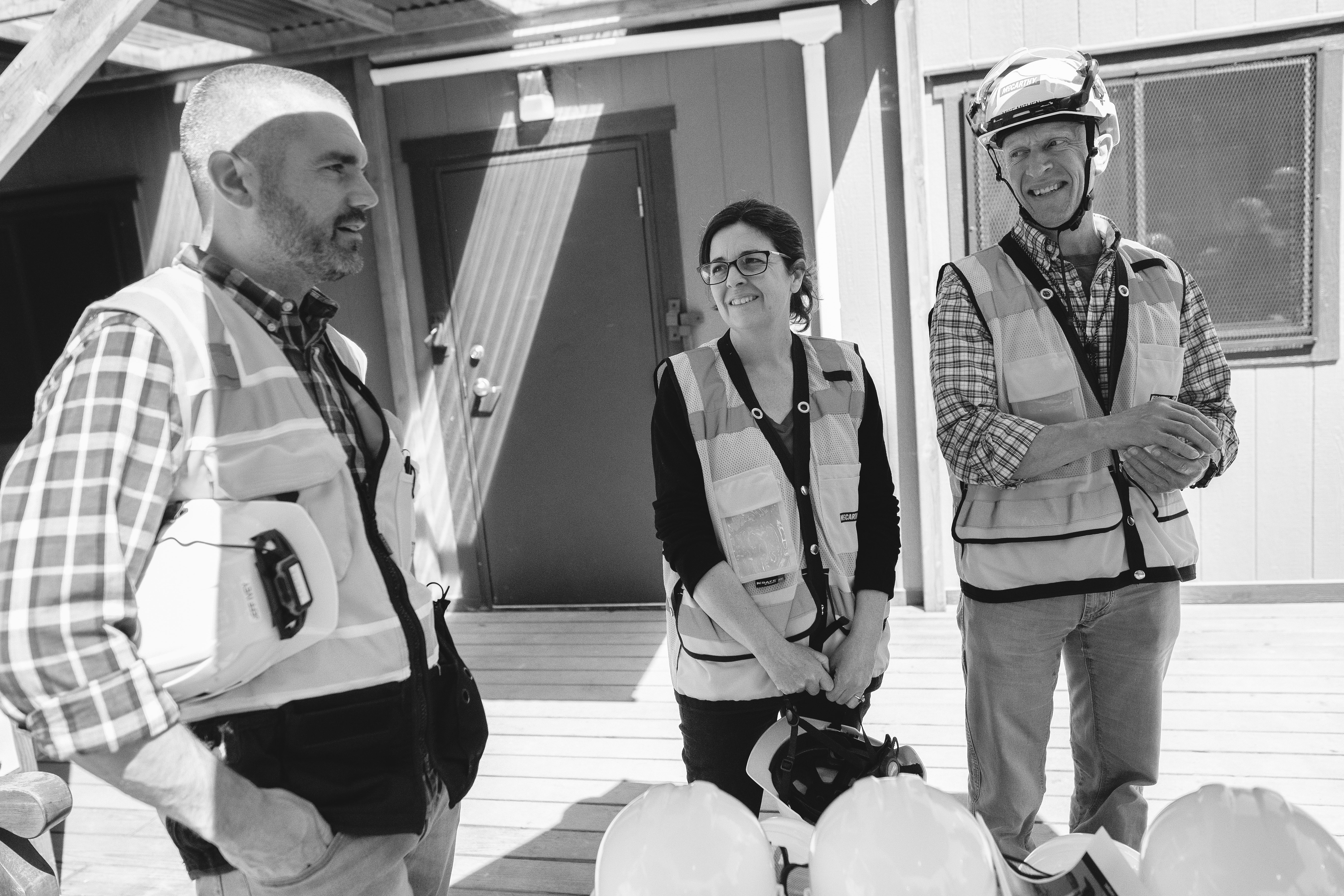 Jeff Ivey (left) chats with Olivia Crawford (center) and Michael Mithen (right) before a faculty tour of construction. 