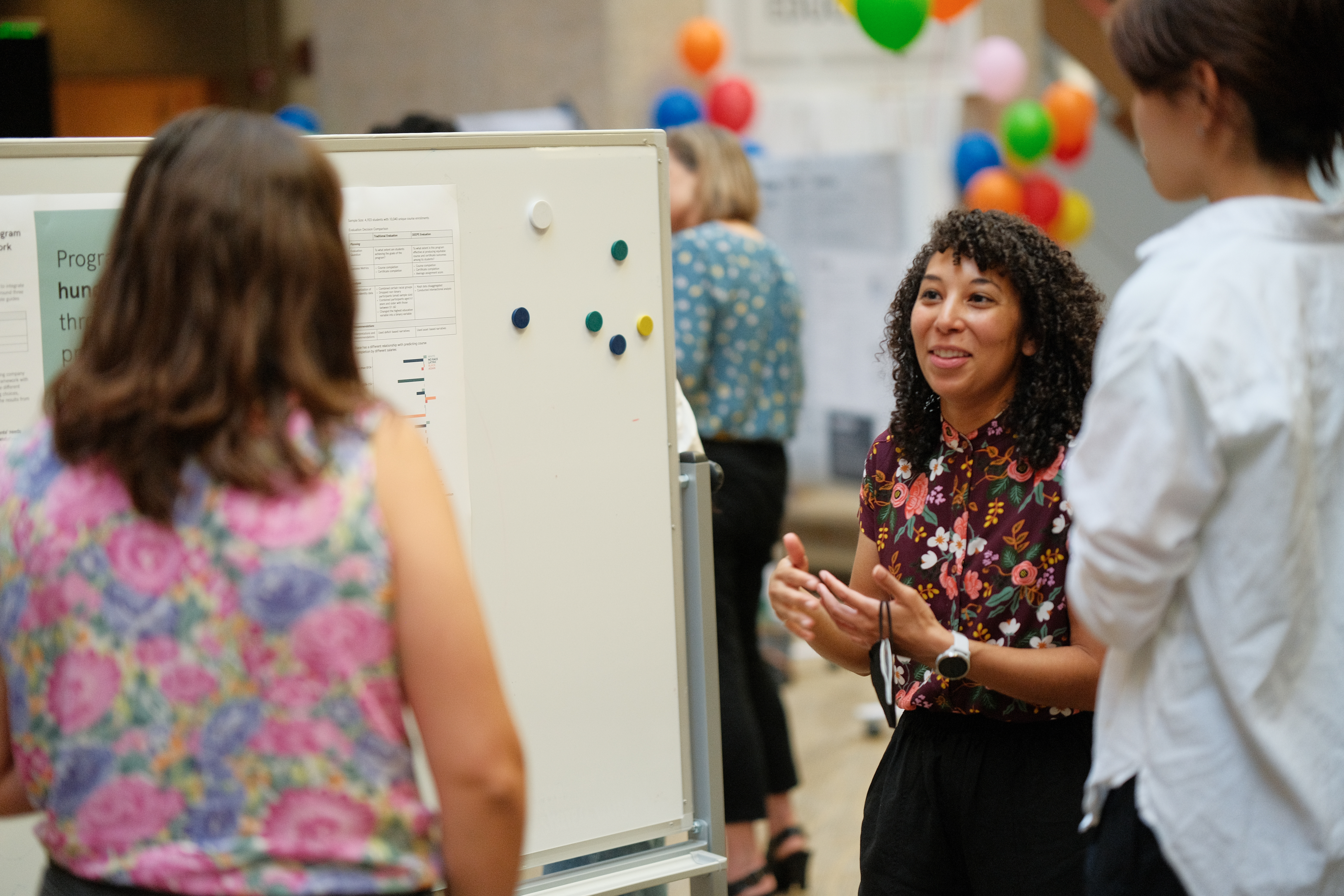 Photo of EDS student presenting her project in front of two people