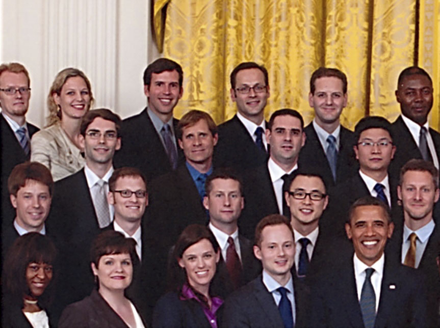 In 2011 President Barack Obama (first row, far right) joins Carla Pugh (first row, far left) and other winners of the NIH's prestigious early career award.