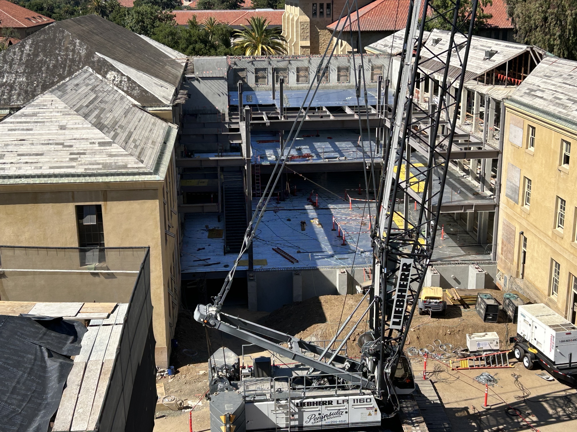 An overhead image of the north building construction site, with the floor, framing, and staircases of the forum taking shape