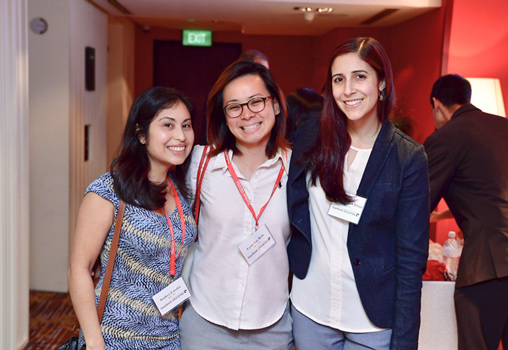 Photo of three student's/alumni at an event