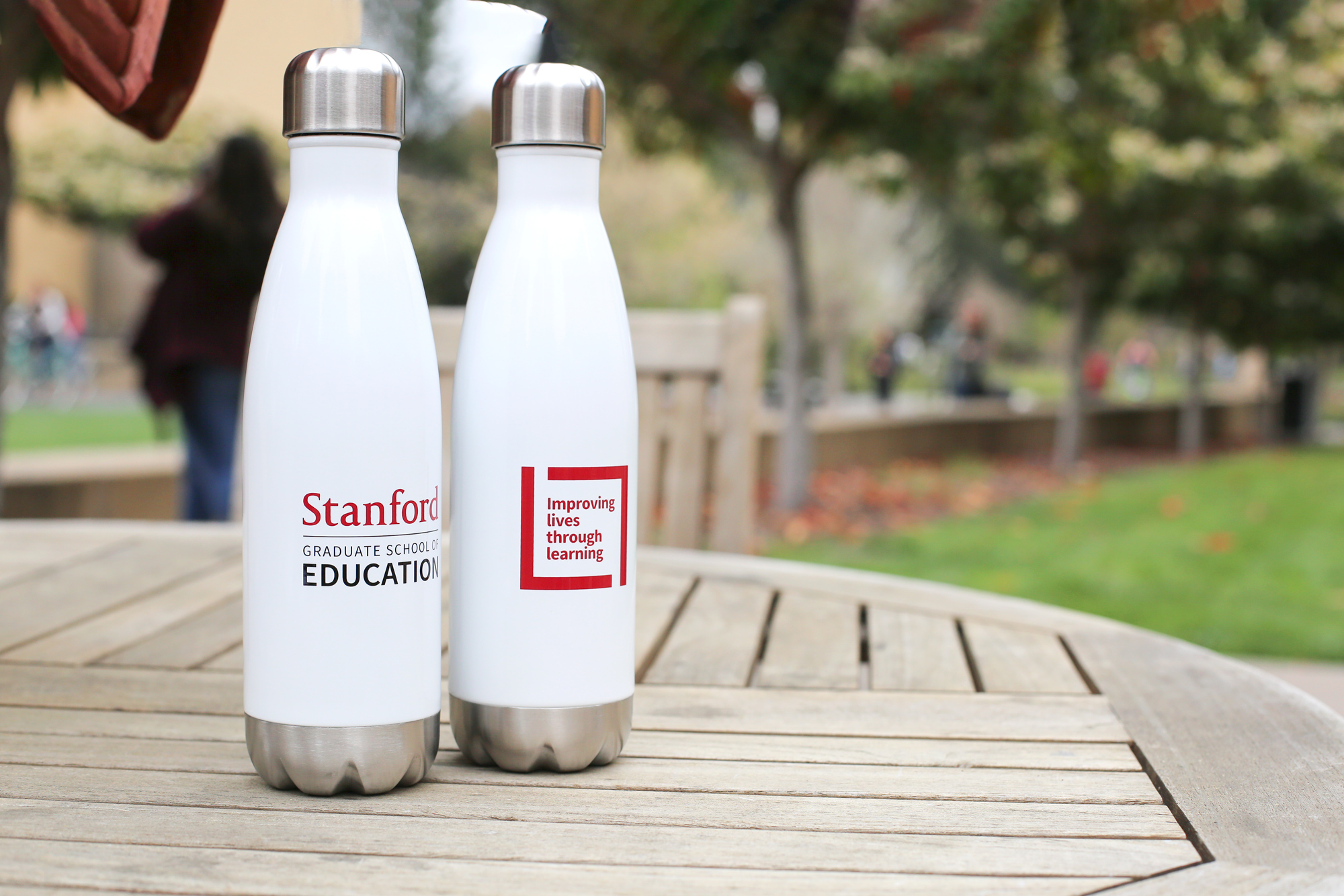 Photo of two white bottles with red GSE and ILTL logos