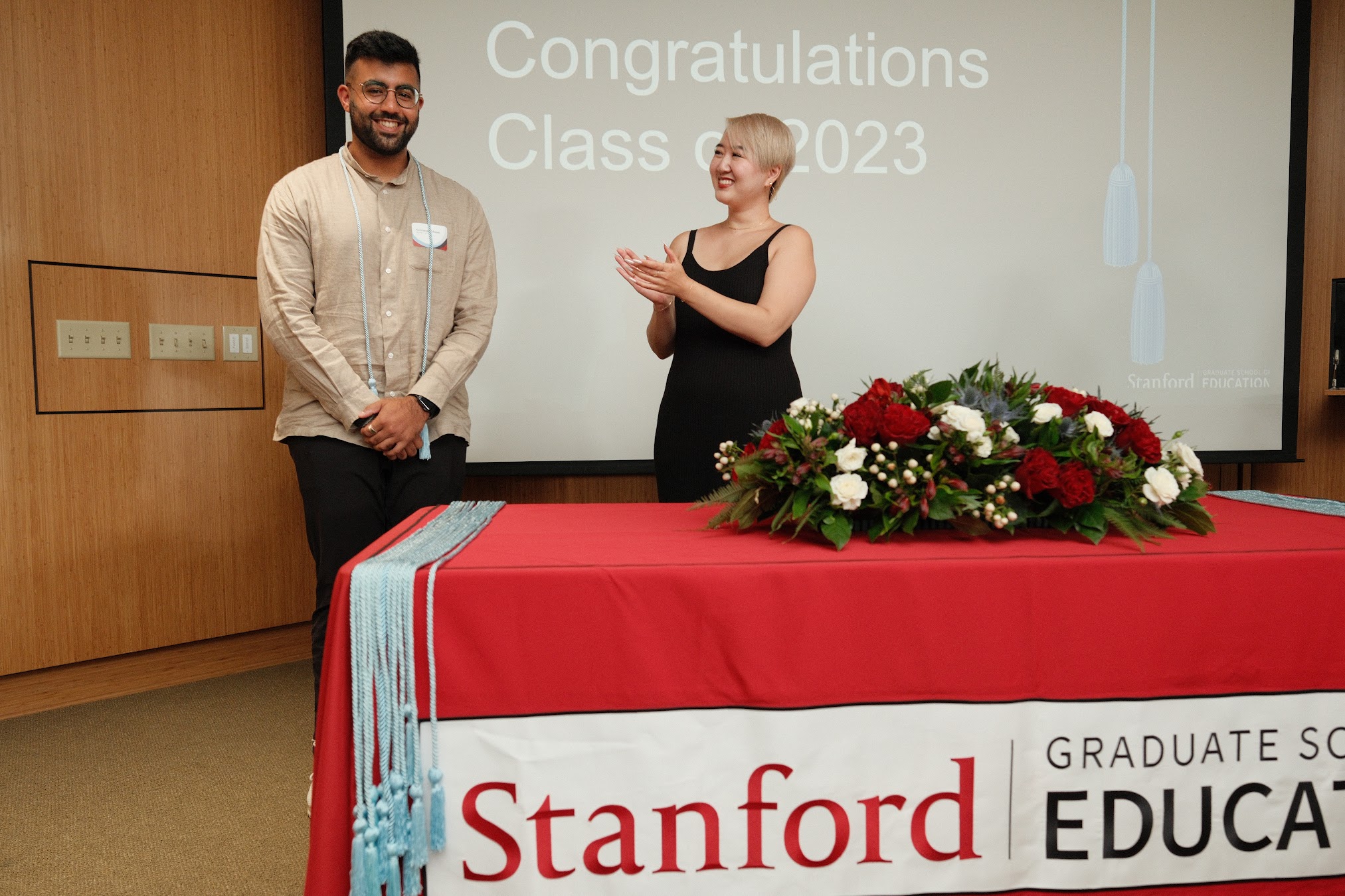 Neel Kishnani (left) receives his cord for completing the minor of education with the GSE. (Photo: Ryan Zhang)