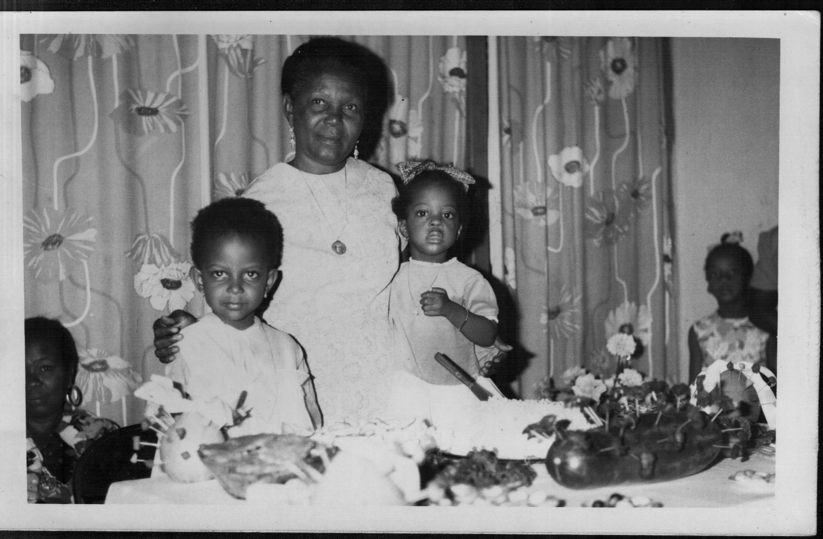 Alexandra Bernadotte, MA ’07, (left) was cared for by her grandmother (center) in Haiti until she was 8 years old.