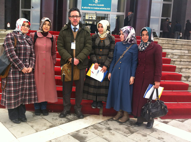 Batuhan Aydagül, MA ’02, (third from left) with students in 2012 at a local think tank meeting in Malatya, Turkey. (Photo courtesy of ERI)