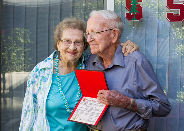 Margaret and Bonnie Gould show the Stanford diploma he received in 1954. This year he was able to participate in the ceremony he skipped 61 years ago. (Photo by Norbert von der Groeben)