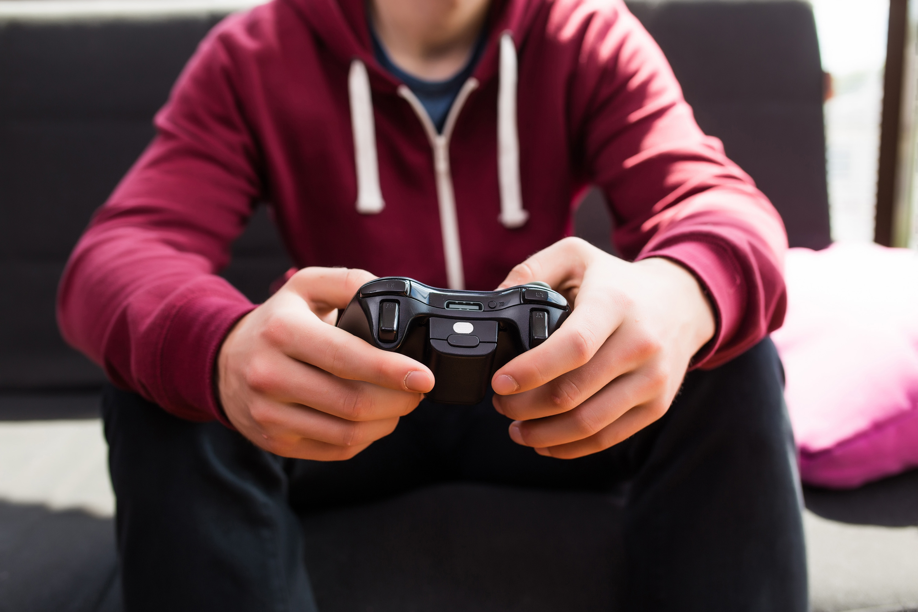 Man playing video games. Photo by Adobe Stock
