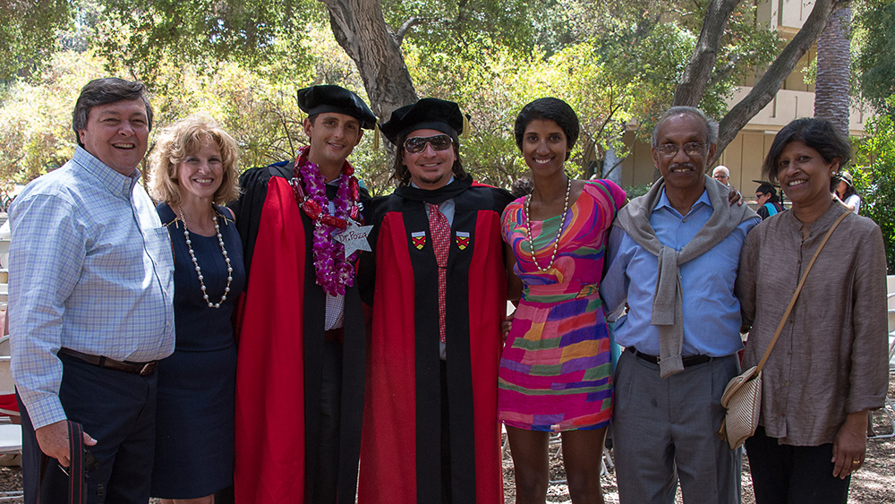 Ph.D. graduates Luis Poza and Joseph Bryan Henderson (and family and friends)