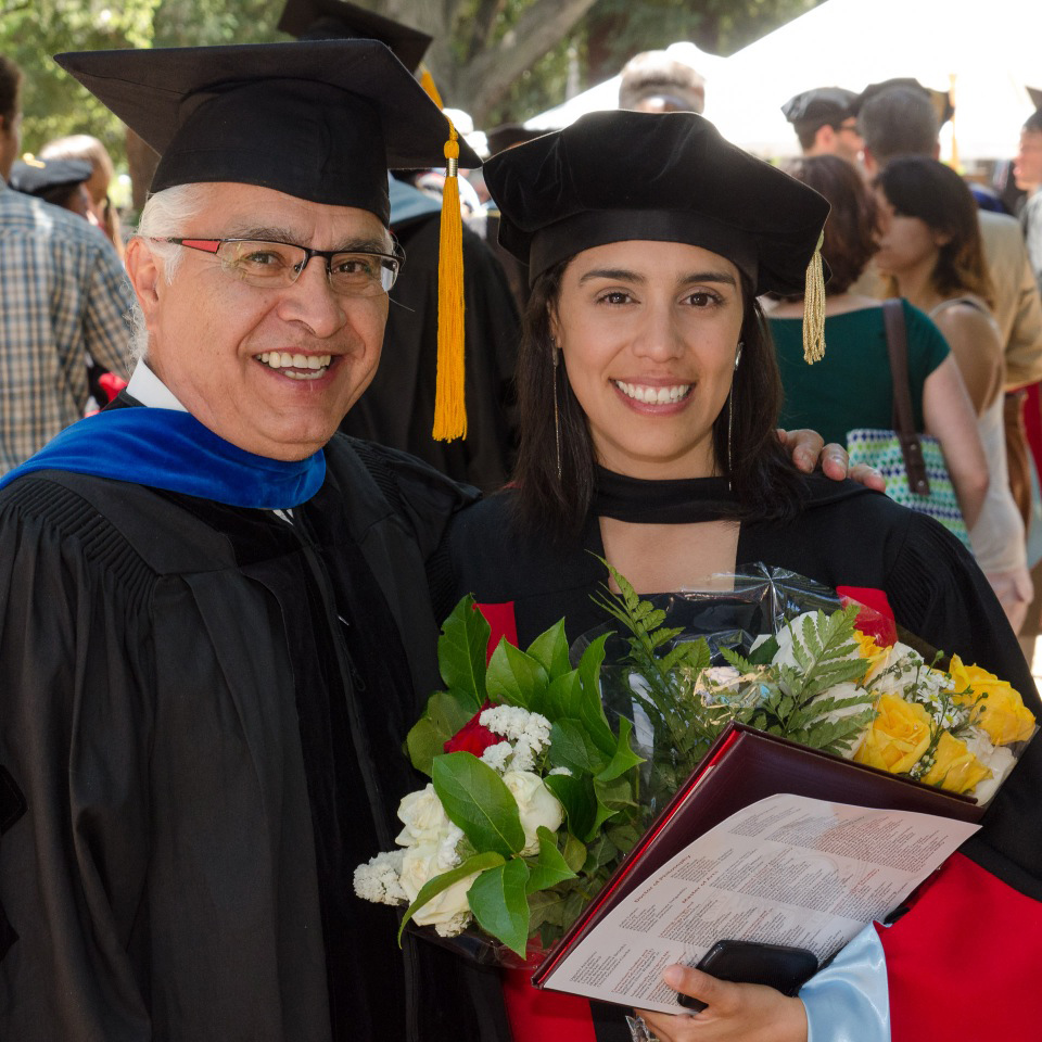 Brenda Jarillo Rabling celebrates her PhD with advisor Amado Padilla. (Photo by Chris Wesselman)