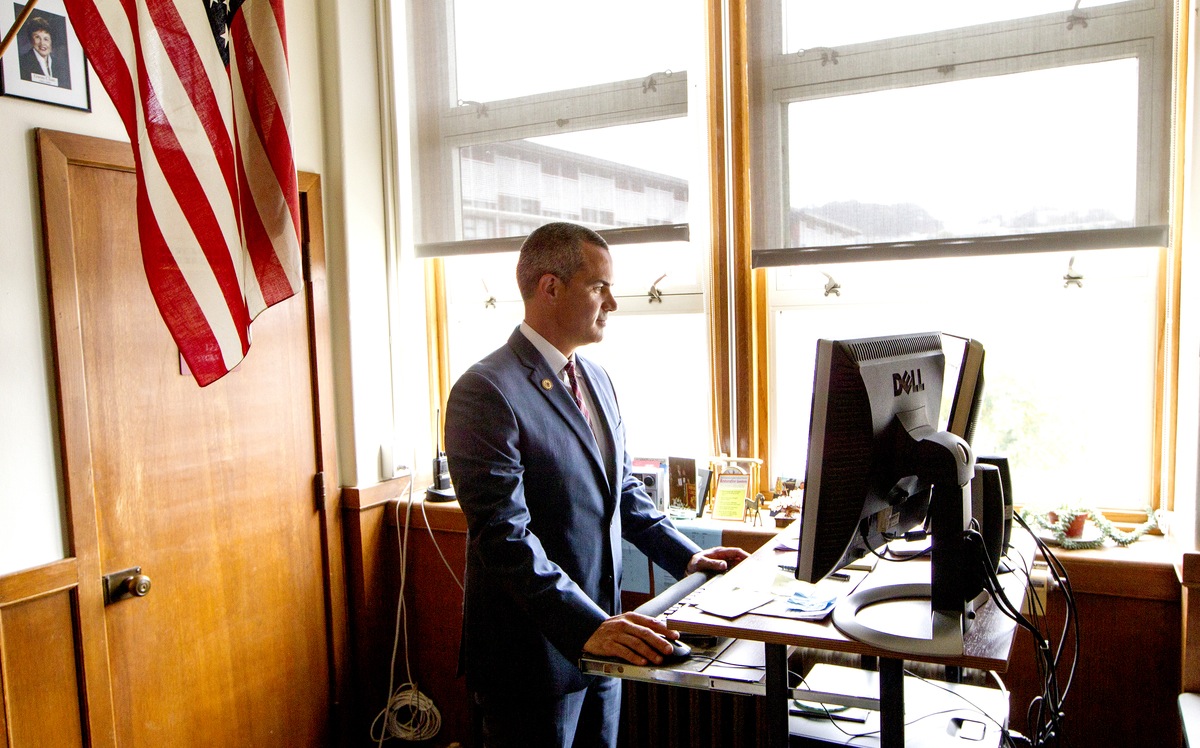 Barnaby Payne works at his desk at Abraham Lincoln High School (Photo by Norbert von der Groeben)
