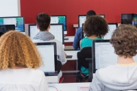 Photo of students in a computer classroom.
