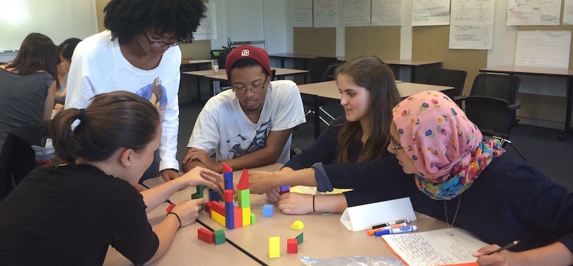 Group of students playing with blocks
