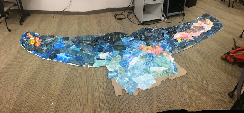 Student artwork in shape of a whale fin