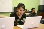 Female student on a laptop.