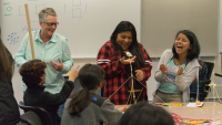 Cathy Williams, left, works with students during a Youcubed math workshop for girls at Stanford. (Photo: Marc Franklin)