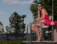 A lifeguard at a pool. A new study suggests summer youth employment may lead to improvements in school attendance and other educational outcomes. (Photo by www.learningdslrvideo.com)
