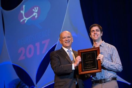 Photo of Ido Davidesco accepting Next Generation award for outstanding contributions to public communication, outreach, and educ