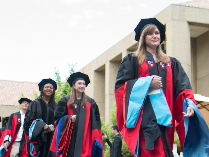 Doctoral students in graduation robes