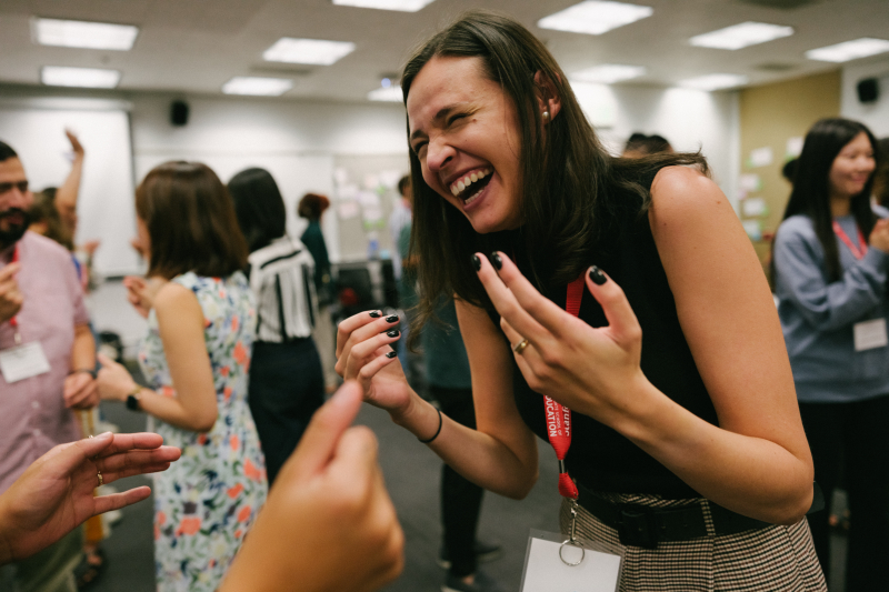 Students, including ICE student Ana Almeida (foreground), laugh together during an improv session. (Photo: Ryan Zhang)