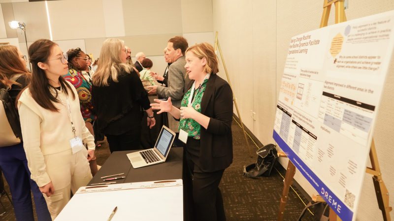 Bethany Elston, a researcher at Northwestern University, shares her team&#039;s exhibit on how districts can move toward greater preK-3 alignment and continuity. (Photo: Marc Franklin)