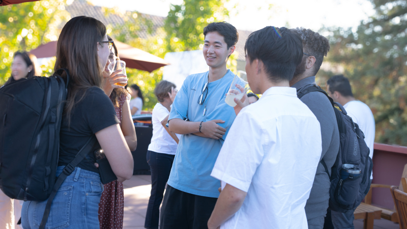 New students mingle and get to know one another at the dean’s kickoff barbecue. (Photo: Joleen Richards)