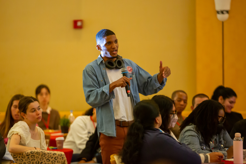 A Stanford law student poses a question to panelists during the conference&#039;s Q&amp;A portion. (Photo: Christine Baker)