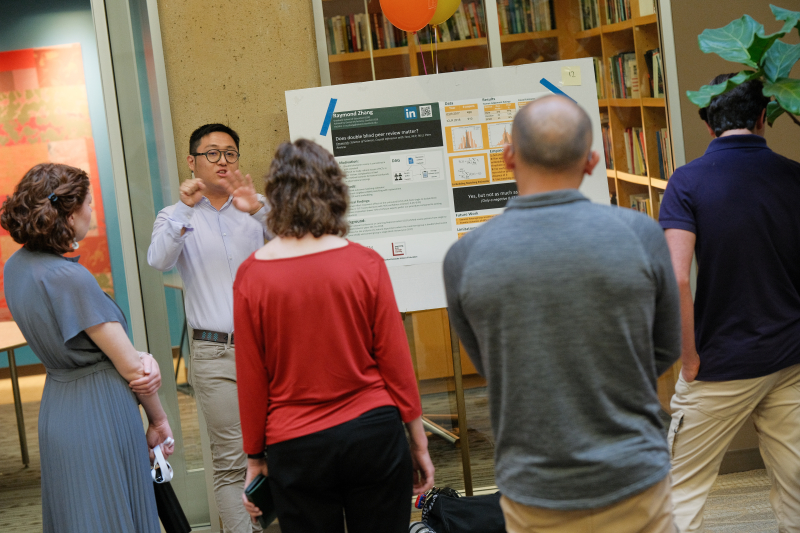 Raymond Zhang, MS ’23, presents his capstone project on peer review policies. (Photo: Ryan Zhang)