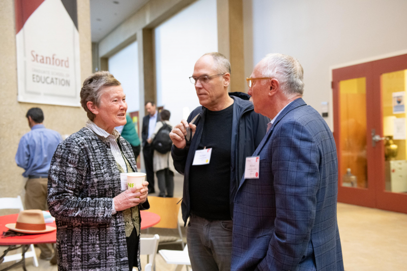 Helen Quinn (left) chaired the National Academy of Sciences Committee that produced the basis for the Next Generation Science Standards. Here she talks with UCLA psychology professor Jim Stigler (center) and Phil Daro, co-author of the Common Core math standards.