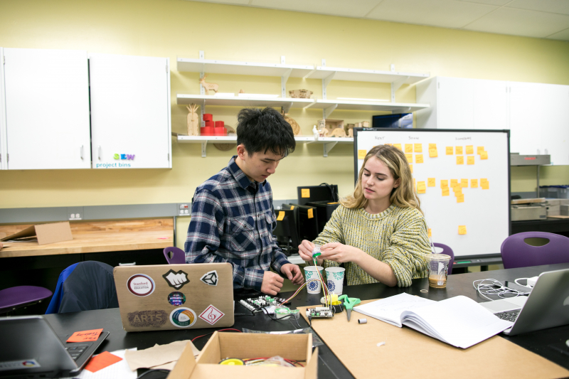 Andy Jiang, a master&#039;s student in the GSE&#039;s Learning, Design and Technology program, and Taylor Hendrickson, a senior majoring in English, work with an electronic circuit-building kit.