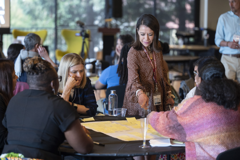 Maricela Montoy-Wilson, assistant director of elementary education at STEP (center right), joins a brainstorming session. (Photo: Rod Searcey)