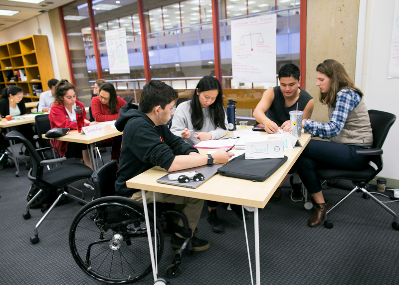 Students working around a table.