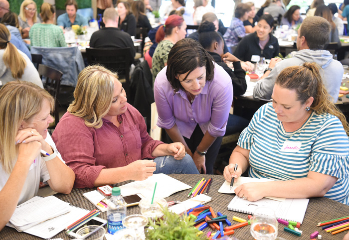 Photo of Jo Boaler working with a group of participants.