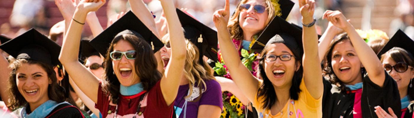 Photo of cheering graduating students.