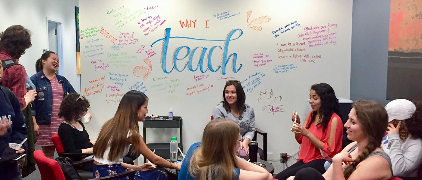 Group of students brainstorming in front of a whiteboard that says Why I Teach