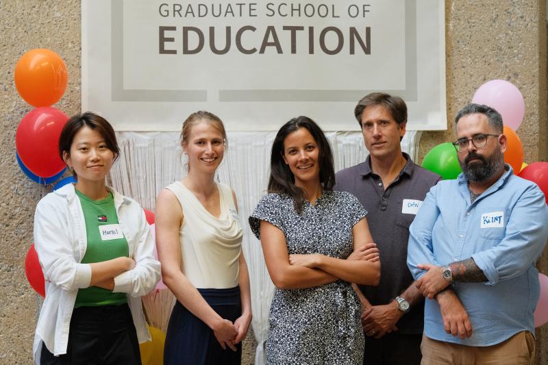 Faculty and PhD students posing for a photo 