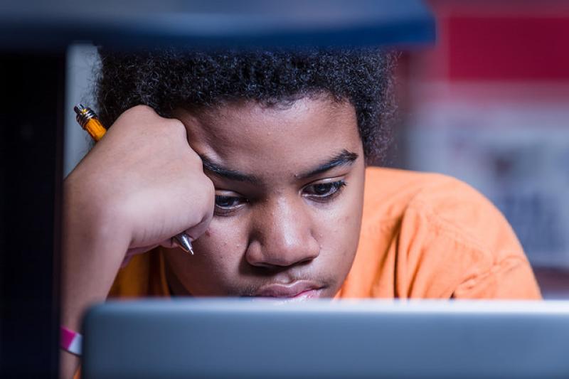 Boy struggling with homework