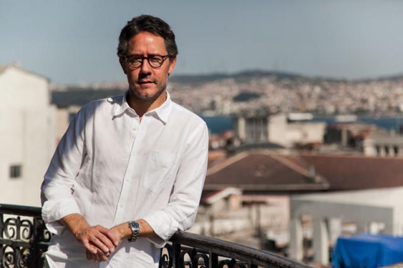 Batuhan Aydagül, MA ’02, in 2013 outside the Education Reform Initiative's office in the Karakoy neighborhood of Istanbul. (Photo courtesy of ERI)