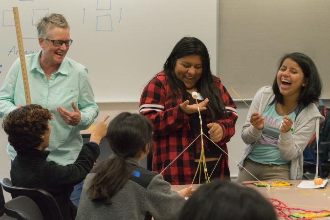 Cathy Williams, left, works with students during a Youcubed math workshop for girls at Stanford. (Photo: Marc Franklin)