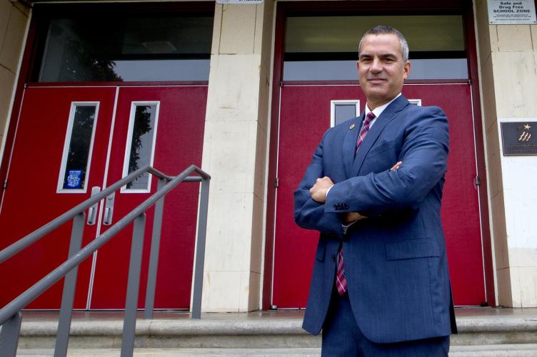 Barnaby Payne stands outside Abraham Lincoln High School (Photo by Norbert von der Groeben)