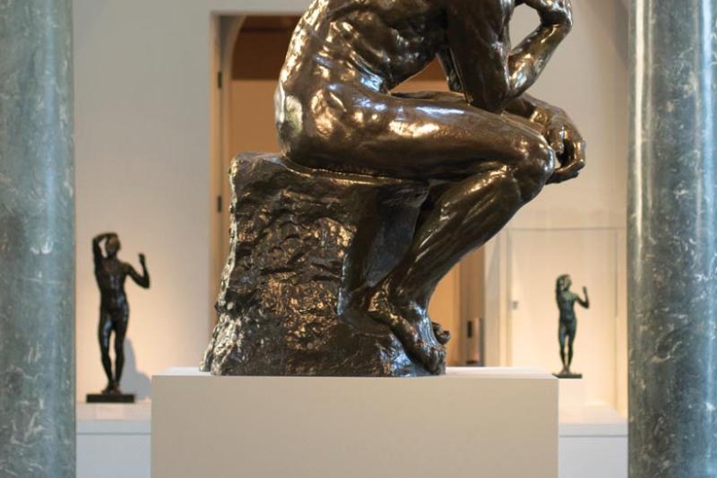 The Thinker, by Auguste Rodin, is on view at Cantor Arts Center. An image of the statue also appears on brochures celebrating the "Thinking Big About Learning" symposium on Oct. 18. (Tamer Shabani)