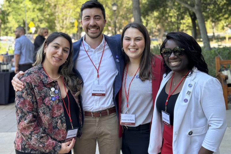 Doctoral students at the Milestone Celebration with their pins.