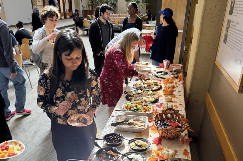 Staff and students are grabbing tea and snacks at CommuniTea Time.