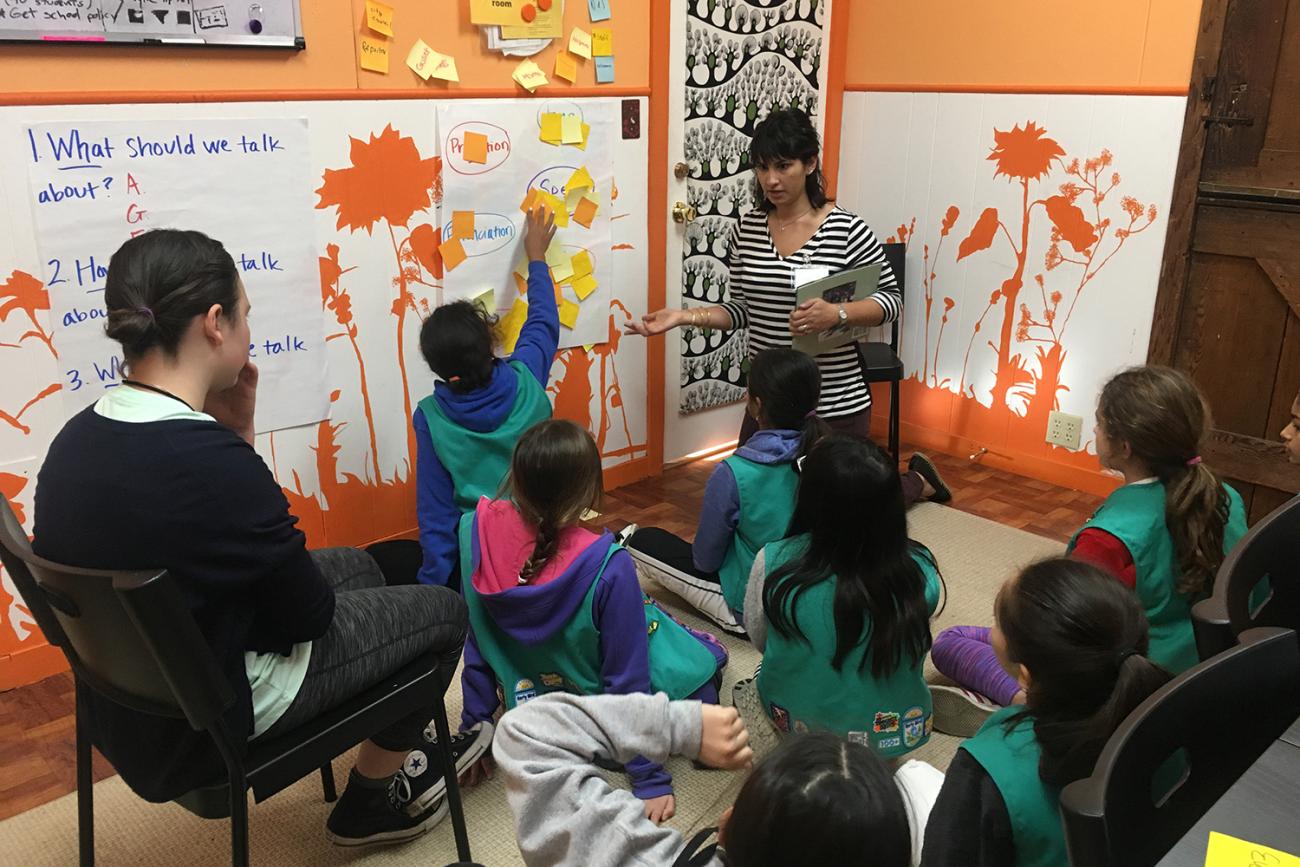 Photo of Girl Scouts preparing to survey community members for an environmental project