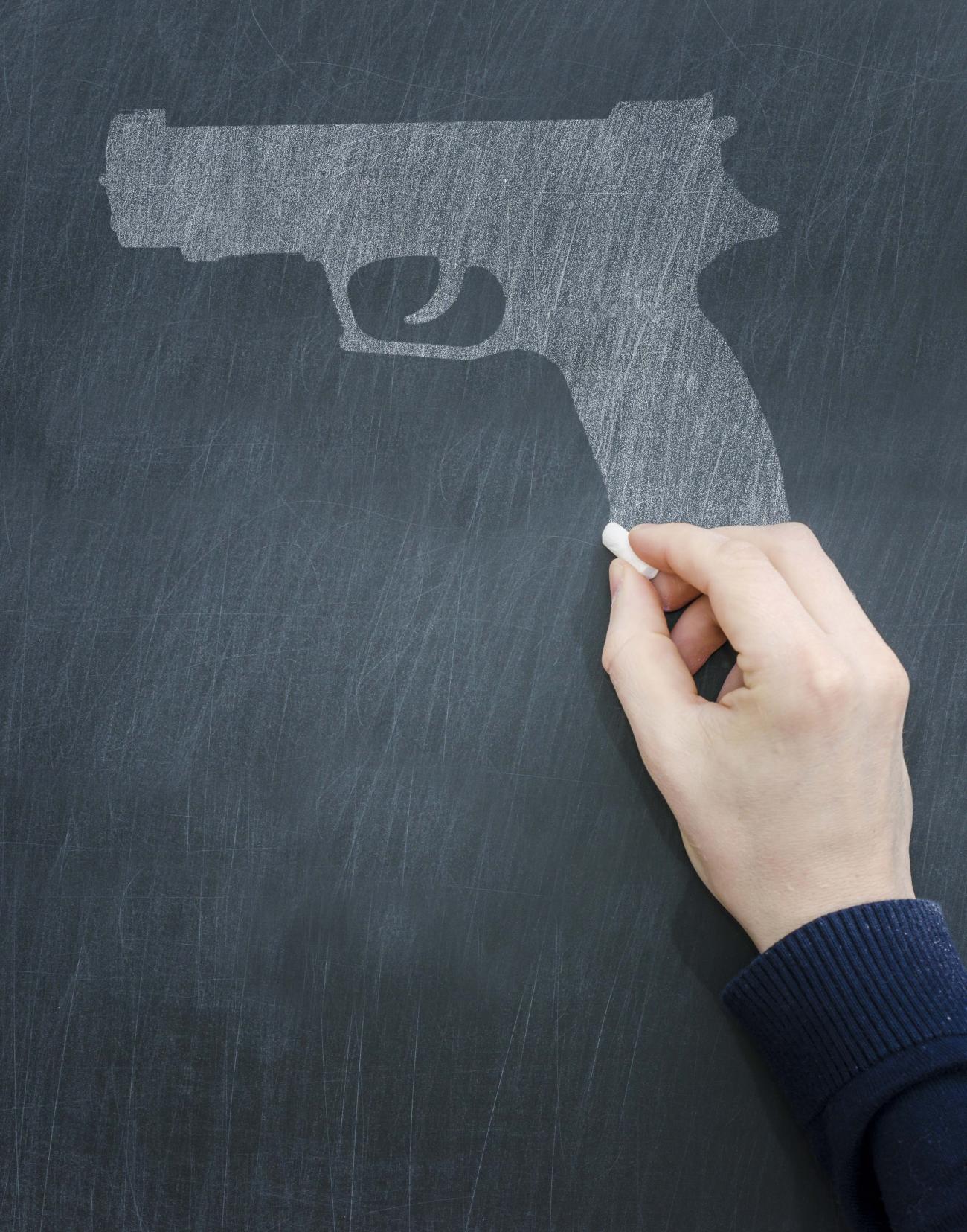 Illustration of a gun being drawn on a chalkboard