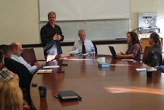 Sean Reardon (standing) introduces John Easton (center), director of the Institute of Education Sciences, before his talk at Stanford in 2012 to faculty and students in the doctoral training program. (Photo by Hiep Ho/CEPA)