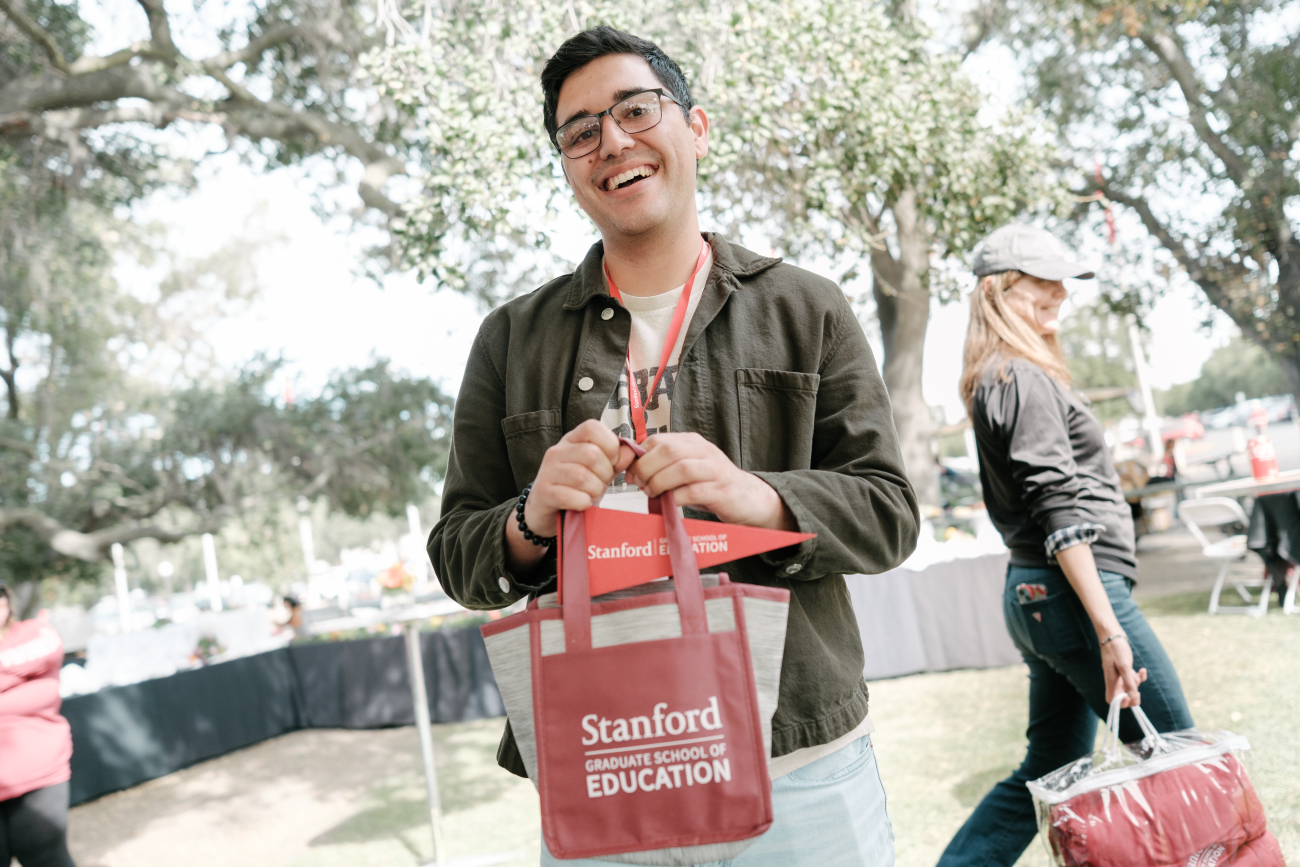 GSE student with swag bag at tailgate 2024