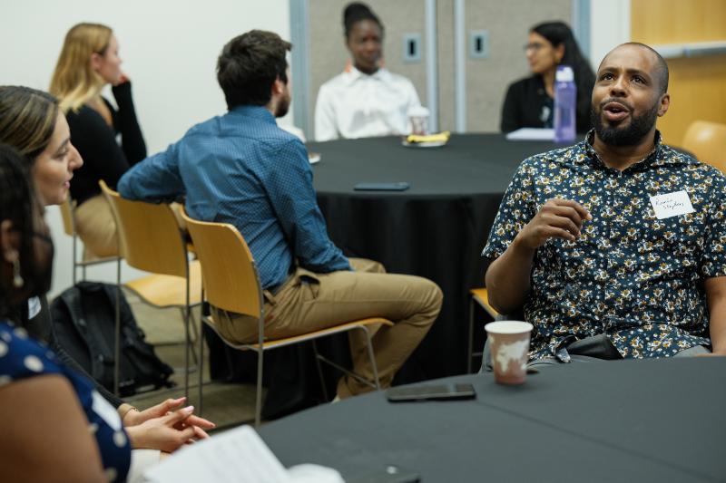 Attendees discuss ideas and interests at an open session. (Photo: Ryan Zhang)