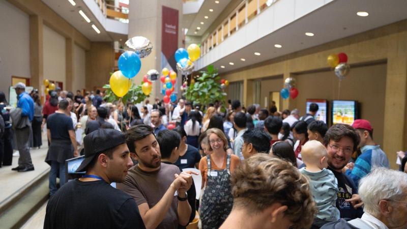 Community members and guests interact with student projects at Expo. (Photo: Joleen Richards)