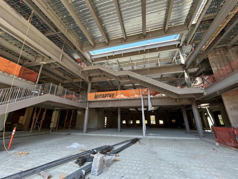 Once the metal decking of the new north building forum is complete, staircases and concrete slabs for the floors are added. July 2024 (Photo: McCarthy Construction Co.)