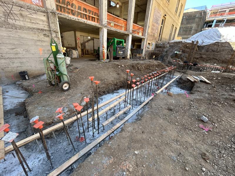 The construction team excavated below grade in order to place footings to brace the new central core structure. (Photo: McCarthy Building Companies, Inc.)